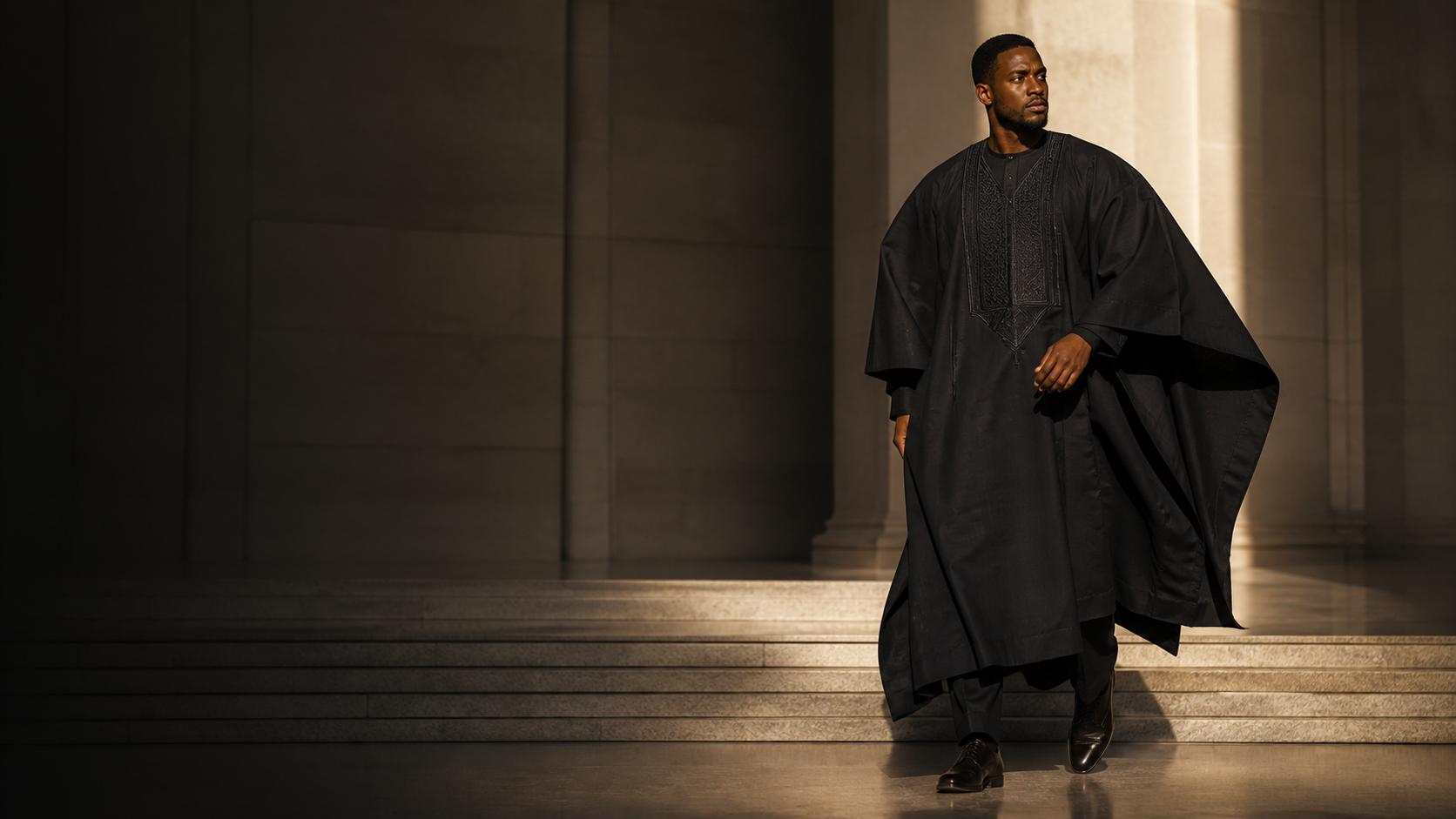 A refined black Agbada in a contemporary architectural setting